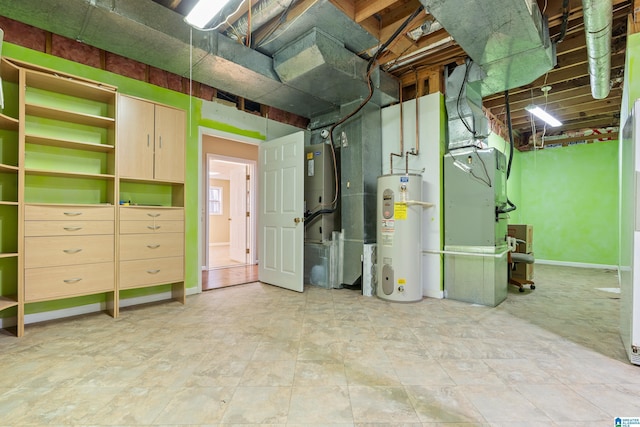 basement featuring heating unit and electric water heater