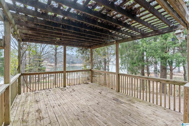 wooden deck featuring a water view