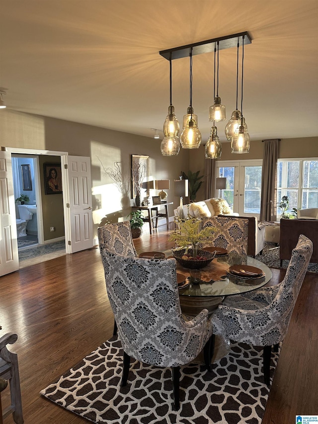 dining space with french doors and dark hardwood / wood-style floors