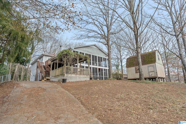 back of property featuring a sunroom