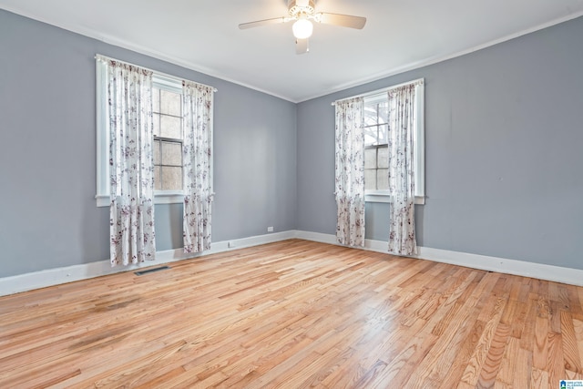 unfurnished room featuring crown molding, ceiling fan, and light hardwood / wood-style flooring