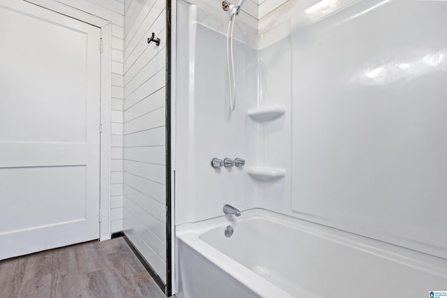 bathroom with shower / tub combination and wood-type flooring