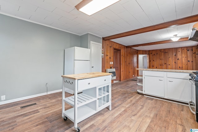 kitchen with white cabinetry, white fridge, wood counters, and light hardwood / wood-style flooring