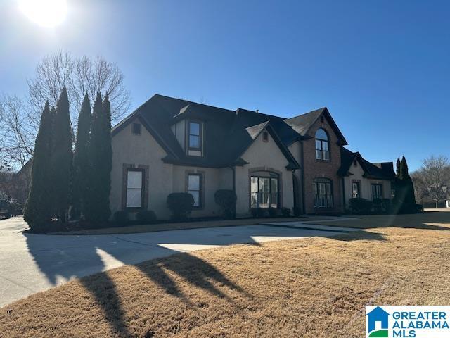 view of front of property with a front lawn