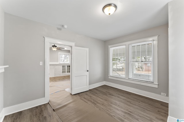 unfurnished room featuring hardwood / wood-style floors