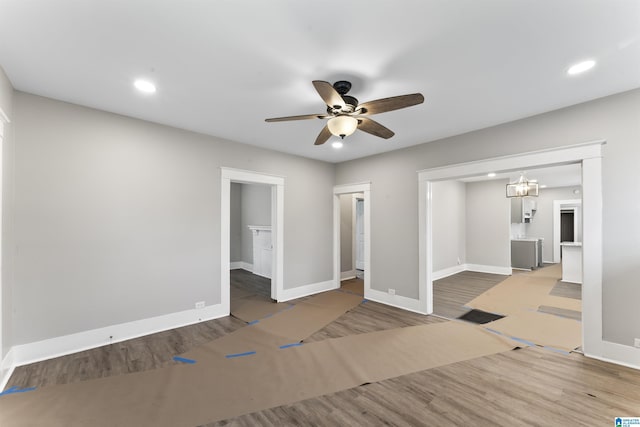 unfurnished room featuring ceiling fan and wood-type flooring