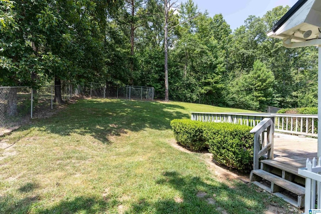 view of yard with a wooden deck