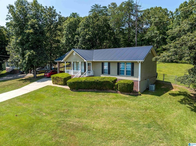 single story home featuring central AC unit, a front lawn, and a porch