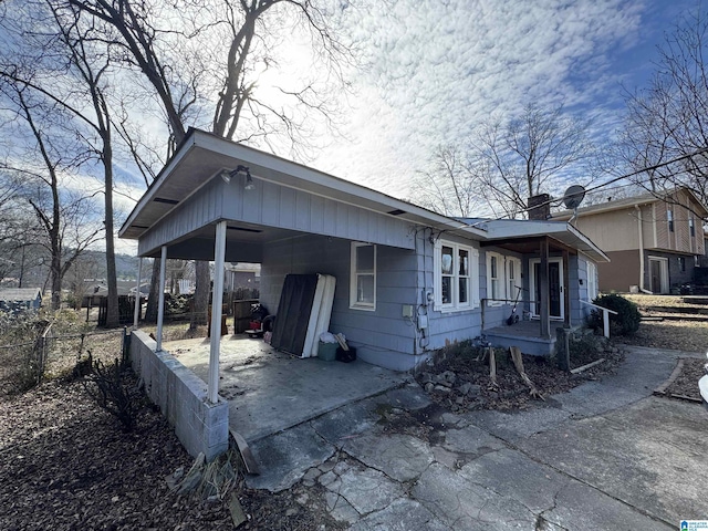 exterior space with a carport