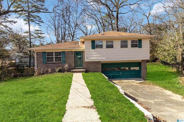 split level home featuring a garage and a front lawn