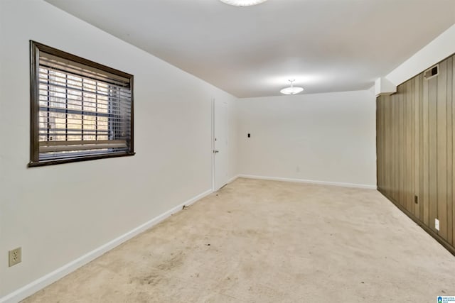 unfurnished room with light carpet