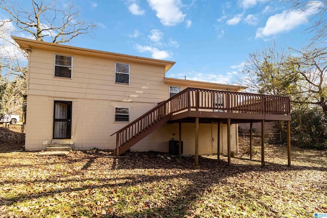 rear view of property with central AC and a deck