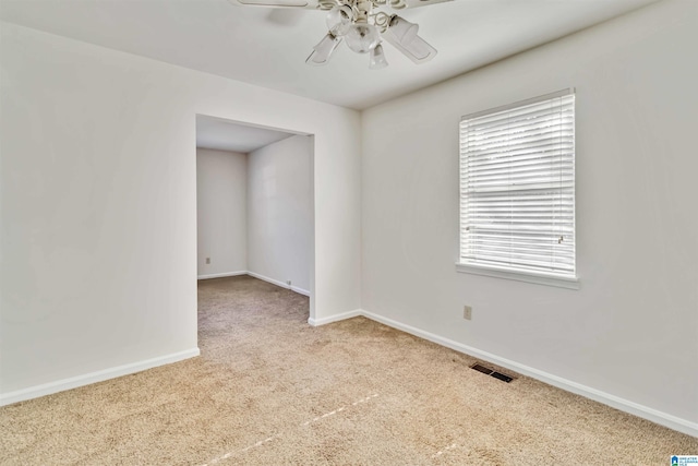 unfurnished room featuring carpet floors and ceiling fan