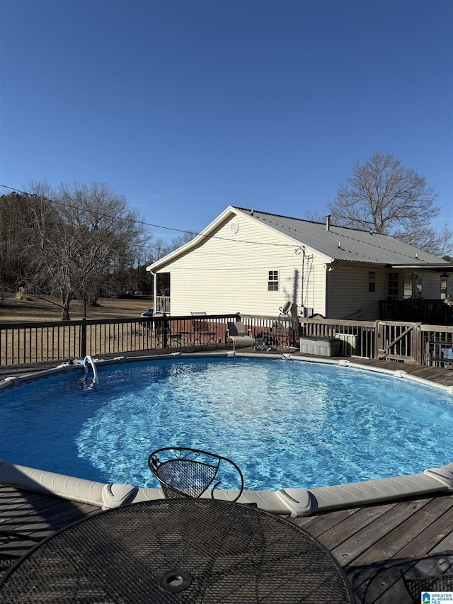 view of pool with a deck