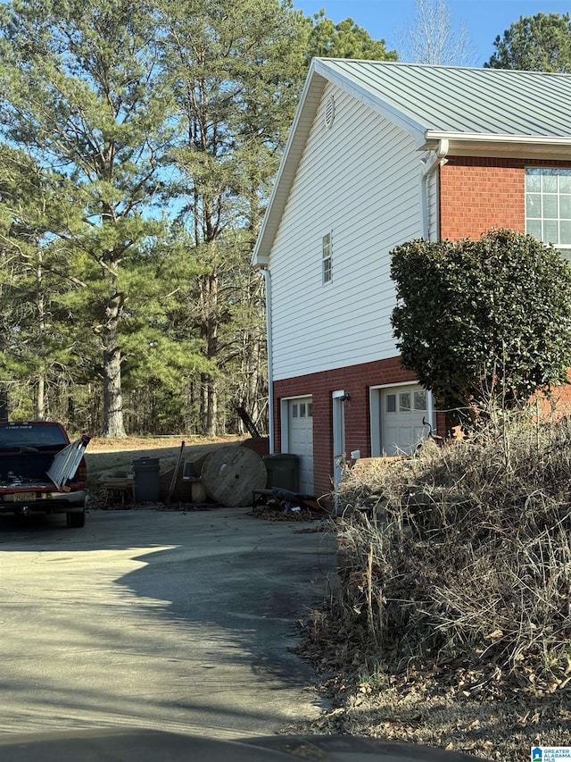 view of home's exterior with a garage