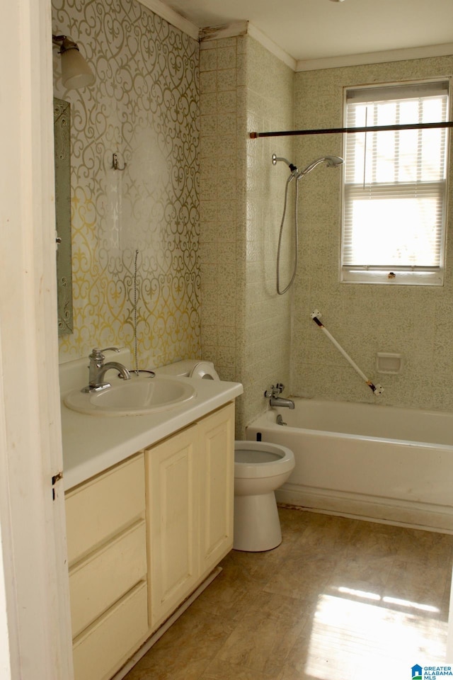 bathroom with bathing tub / shower combination, toilet, and vanity