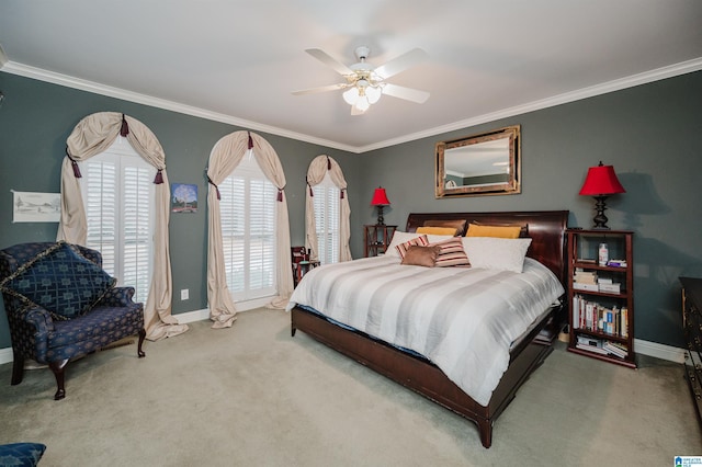 bedroom featuring crown molding, ceiling fan, and carpet flooring