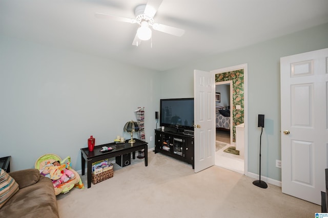 interior space with ceiling fan and light carpet