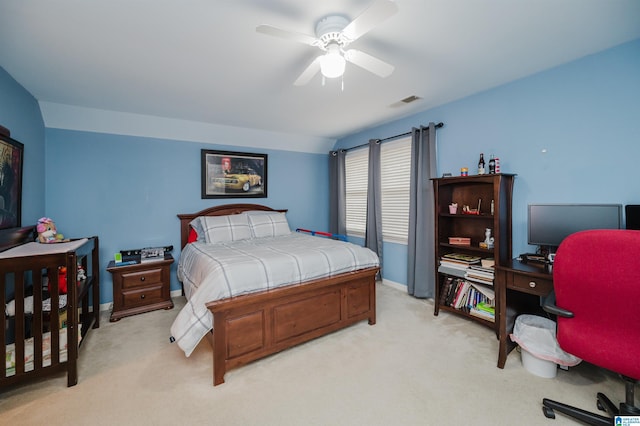 bedroom with ceiling fan and light carpet