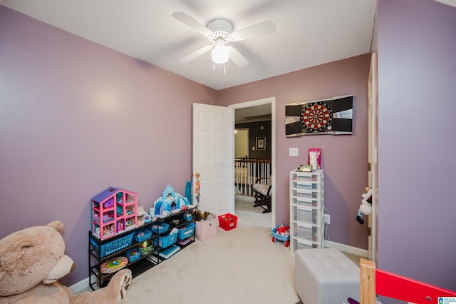 recreation room featuring carpet and ceiling fan