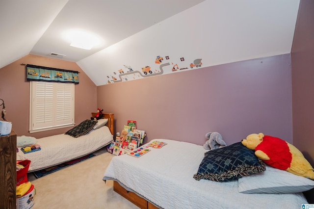 bedroom featuring lofted ceiling and carpet flooring