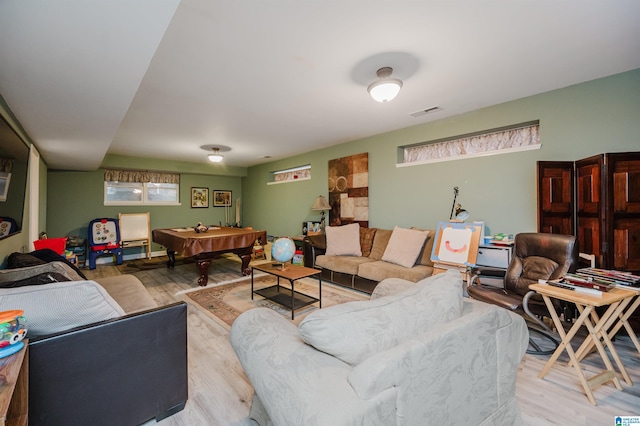 living room featuring pool table and light hardwood / wood-style floors