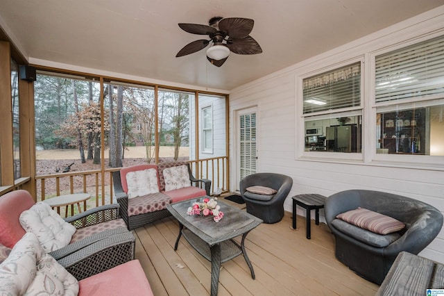 sunroom / solarium with ceiling fan