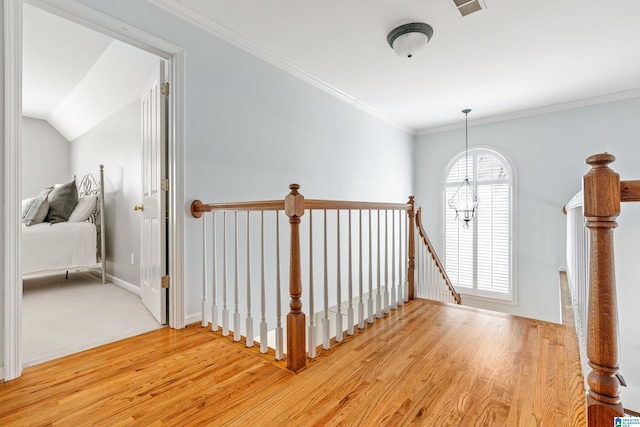 foyer featuring ornamental molding and hardwood / wood-style floors