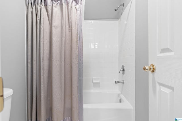 bathroom with shower / bathtub combination with curtain