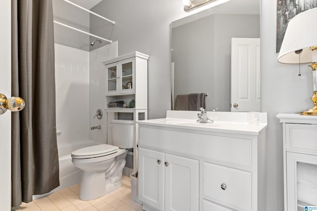 full bathroom featuring tile patterned floors, vanity, toilet, and shower / tub combo