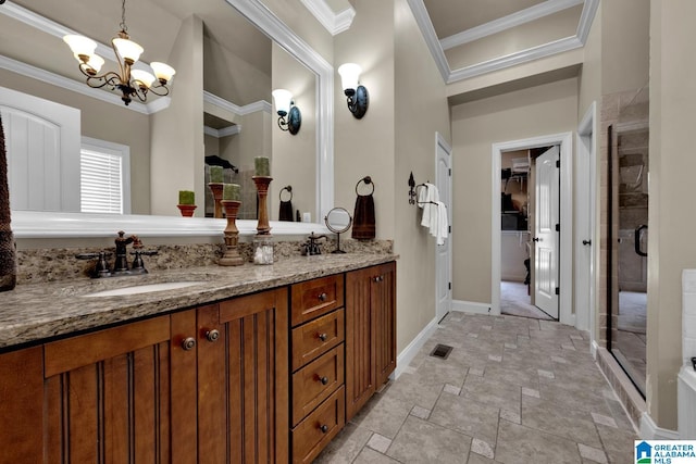 bathroom with an enclosed shower, vanity, ornamental molding, and a chandelier