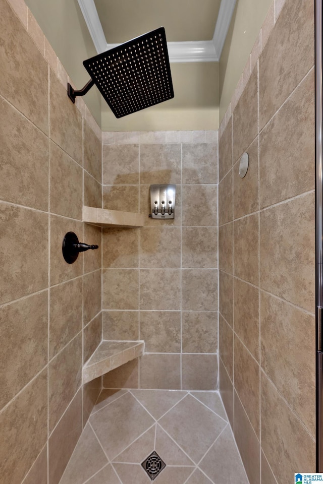 bathroom with tiled shower and ornamental molding