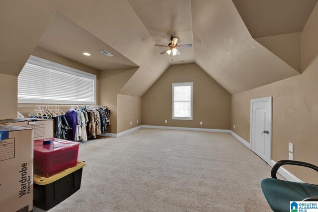 bonus room featuring ceiling fan, lofted ceiling, and carpet