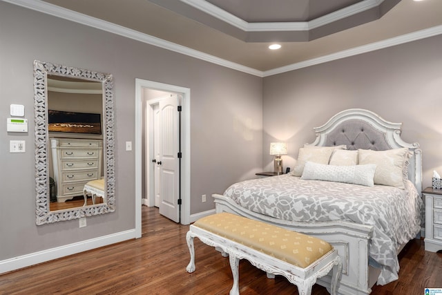 bedroom with a raised ceiling, ornamental molding, and dark hardwood / wood-style flooring