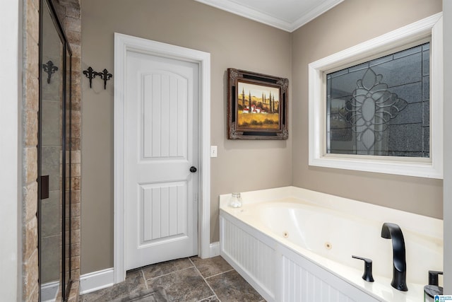 bathroom with ornamental molding and shower with separate bathtub