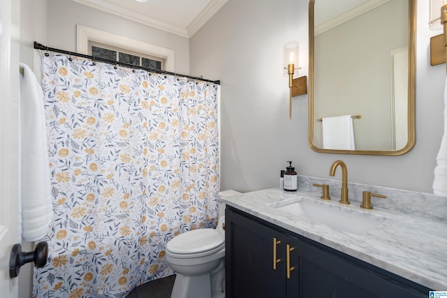 bathroom featuring crown molding, vanity, and toilet