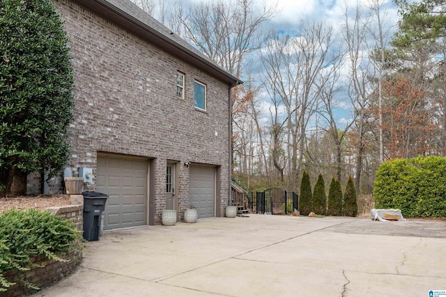 view of side of home featuring a garage