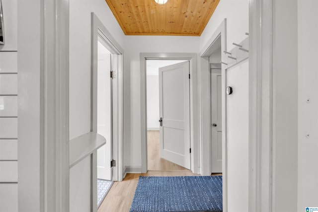 hall with wooden ceiling and light hardwood / wood-style floors