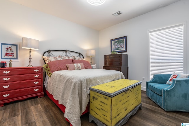 bedroom featuring dark wood-type flooring