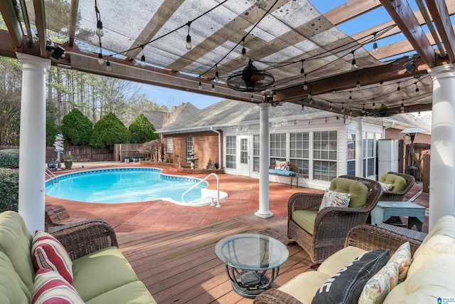 view of swimming pool with an outdoor living space, ceiling fan, and a pergola