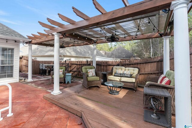 wooden deck with outdoor lounge area and a pergola