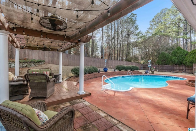 view of swimming pool with a patio area