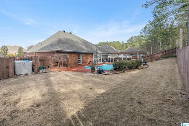 exterior space with a fenced in pool