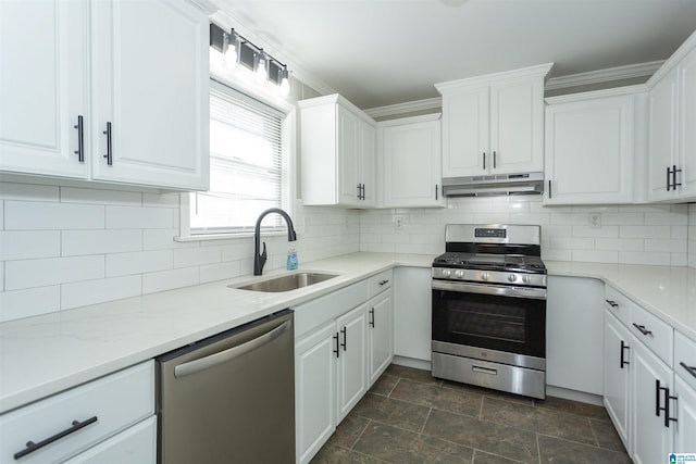 kitchen featuring stainless steel appliances, sink, and white cabinets