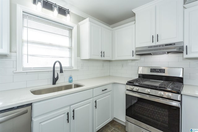 kitchen featuring white cabinetry, appliances with stainless steel finishes, sink, and decorative backsplash