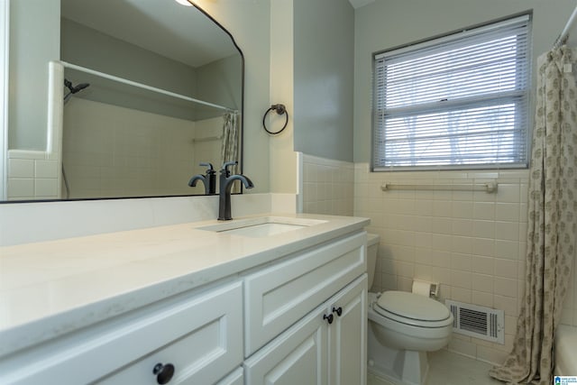 bathroom featuring tile walls, vanity, toilet, and a shower with shower curtain