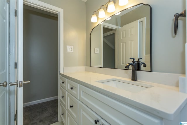 bathroom with baseboards and vanity