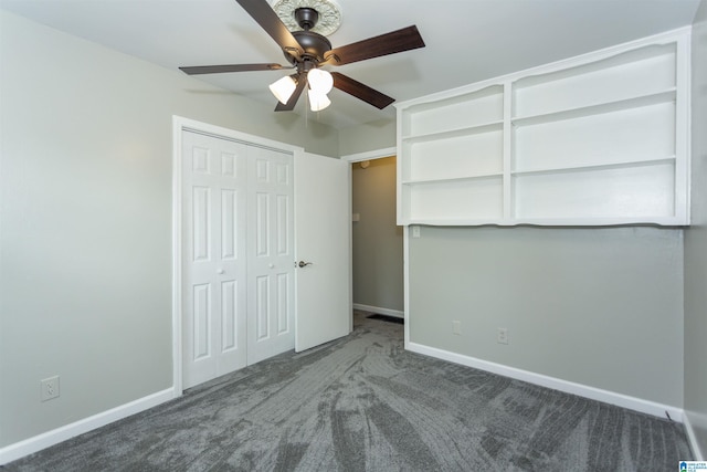 unfurnished bedroom featuring a closet, baseboards, ceiling fan, and carpet flooring