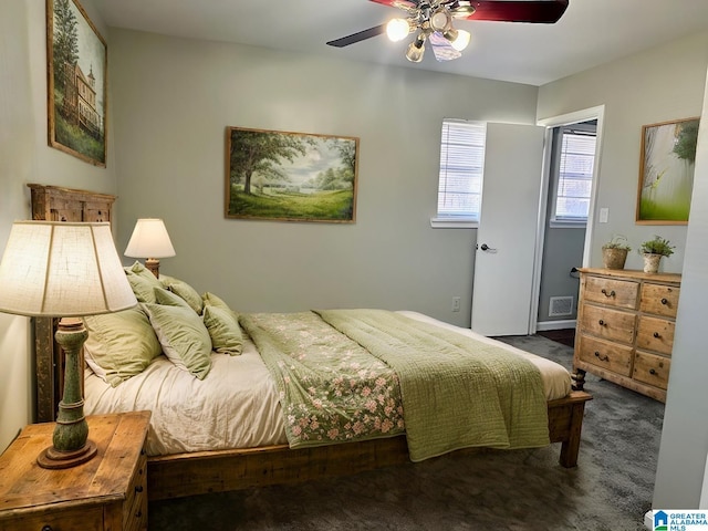 bedroom with a ceiling fan and carpet floors