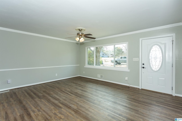 foyer entrance with crown molding, dark wood-type flooring, and ceiling fan